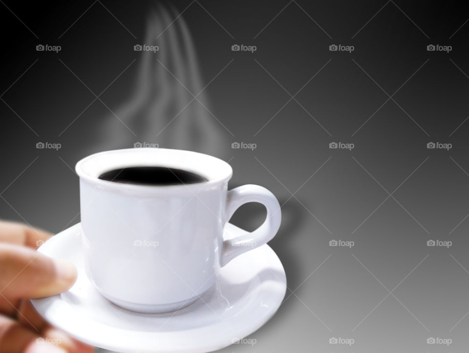 warm black coffee in a white cup