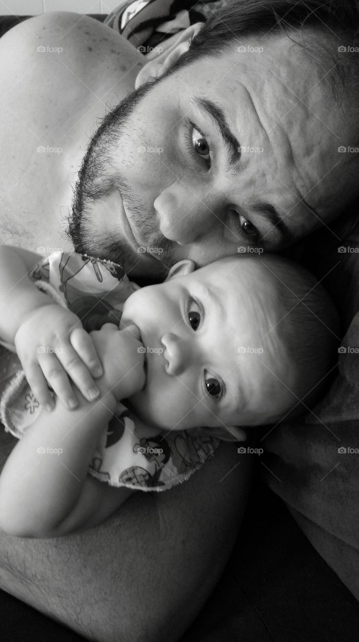 Beard man holding baby girl