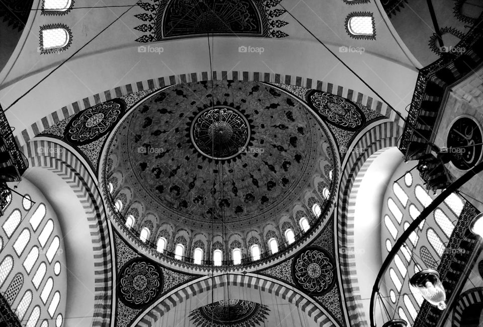 Black and white photo of beautiful mosque ceiling with interesting patterns and shapes on it