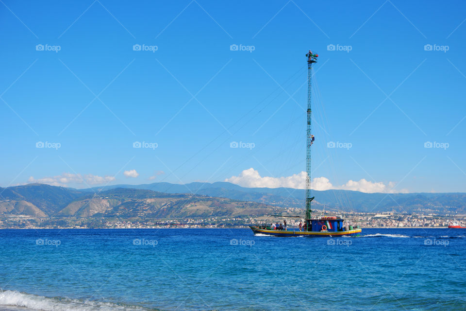 Fishing boat on idyllic blue sea