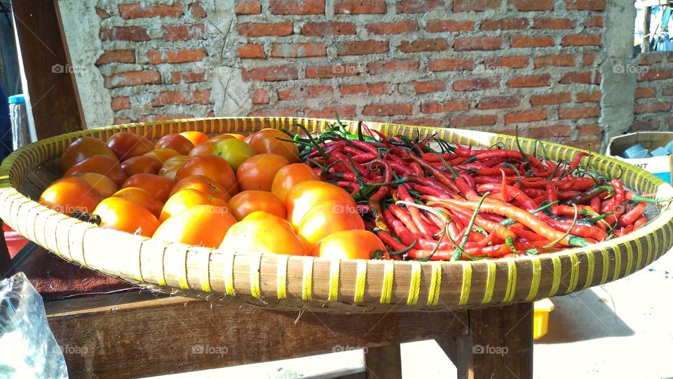 Tomato red chili and green chili in one container