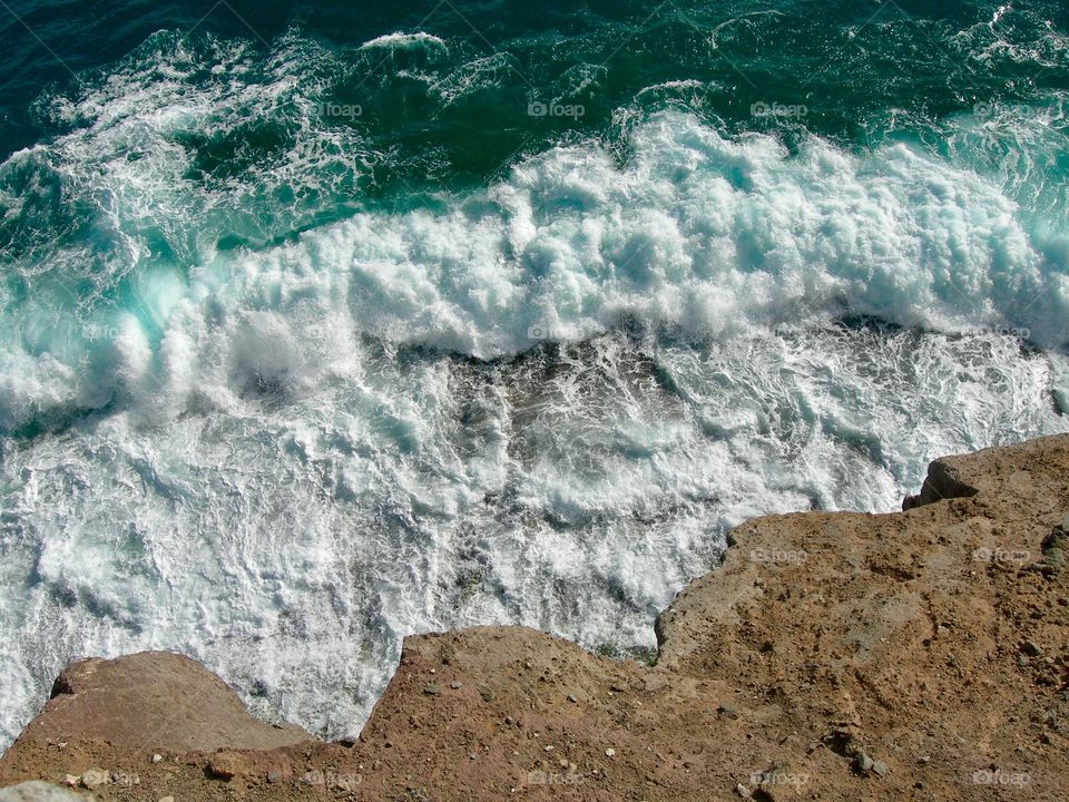 High angle view of waves and the cliff
