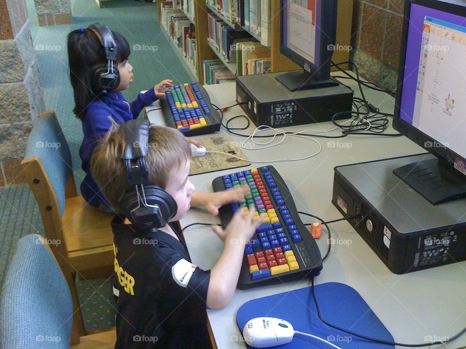 Children using computers during a library visit