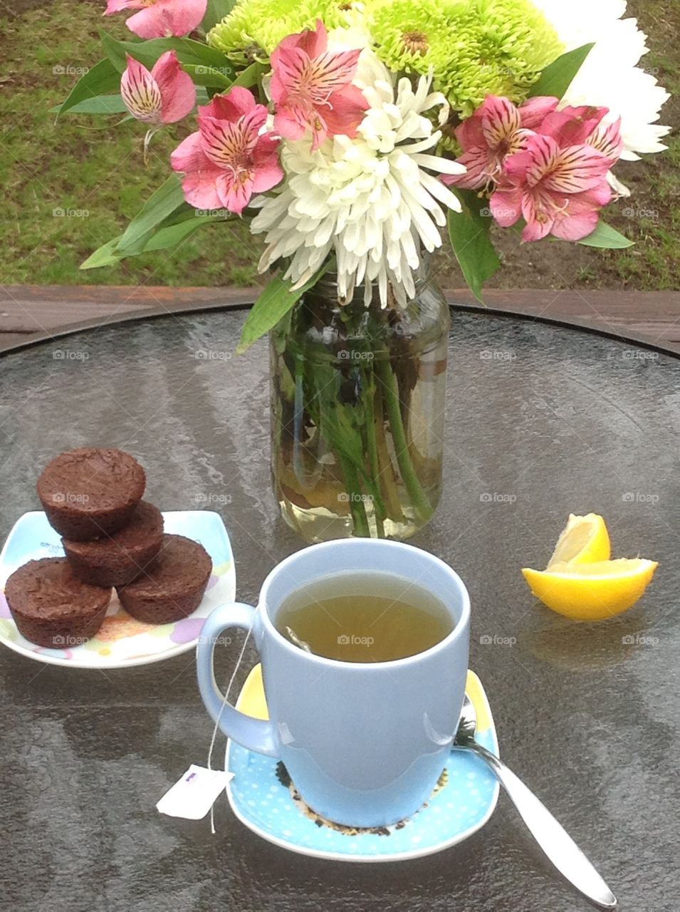 Cup of tea with cakes