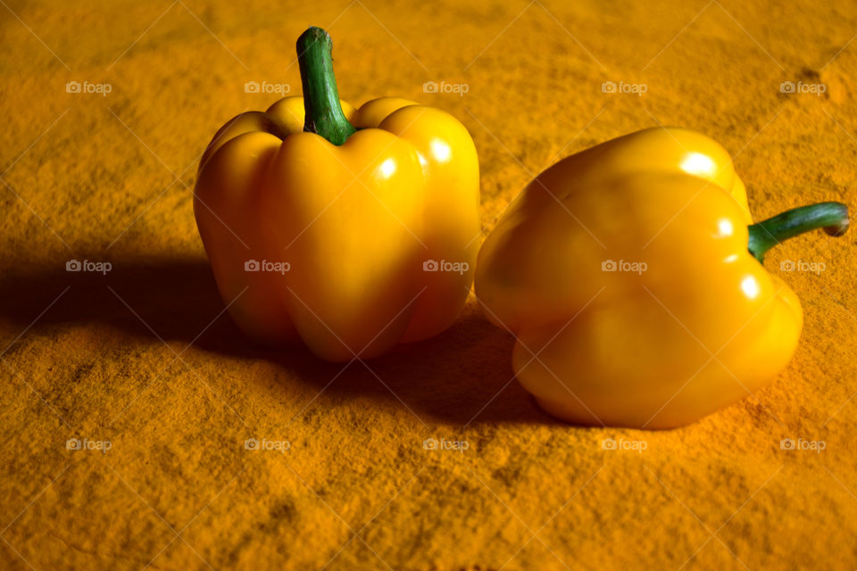 two yellow capsicum