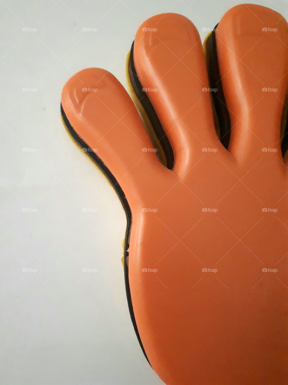 Close up of hand clap plastic toy
