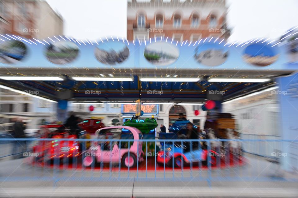 Carousel for children during the Christmas holidays in Trieste, photo with zoom effect