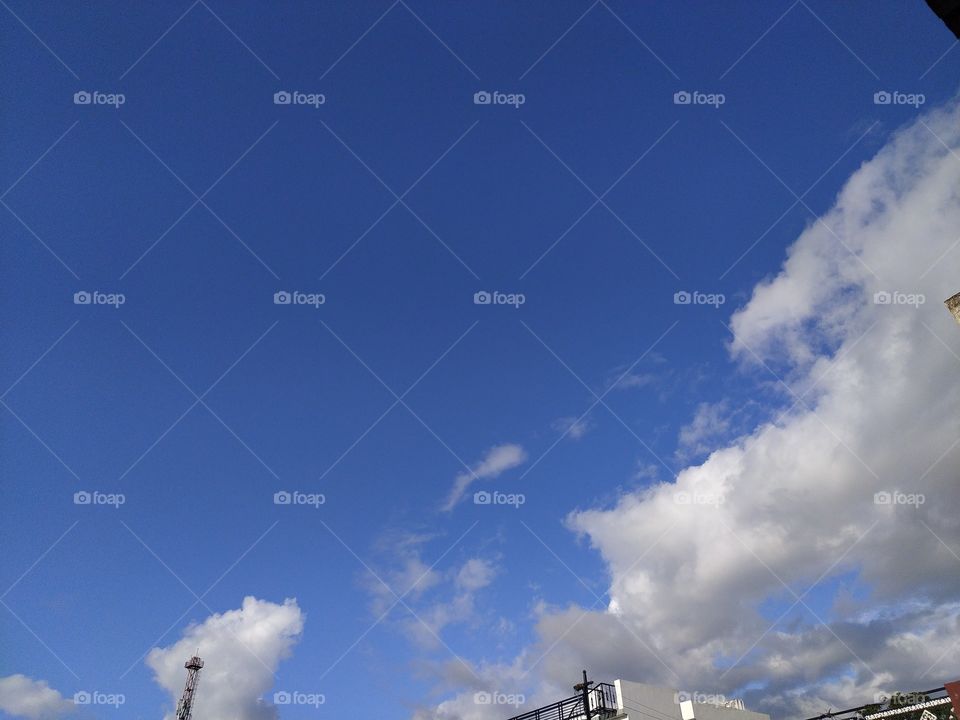 Pre monsoon clouds floating across the beautiful blue sky