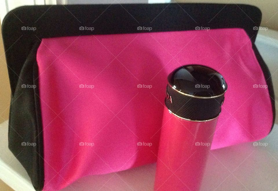 My hot pink purse with hand cream.