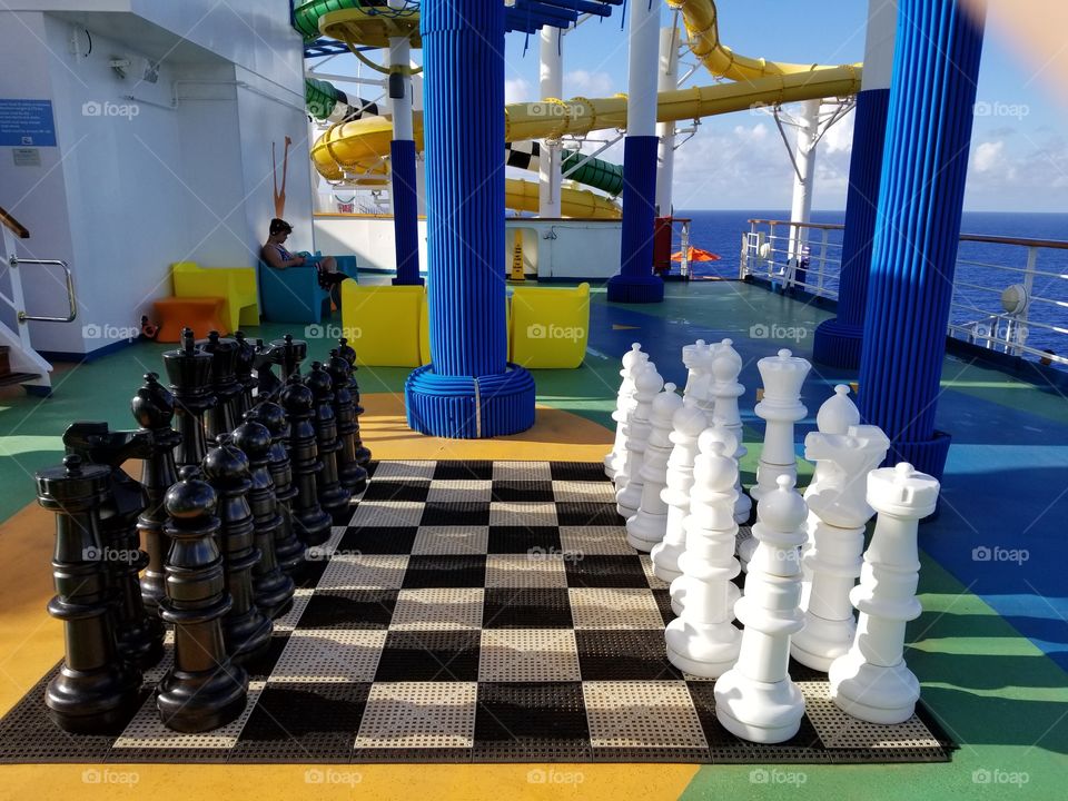 Chess game on the carival cruise ships sunshine in the ocean