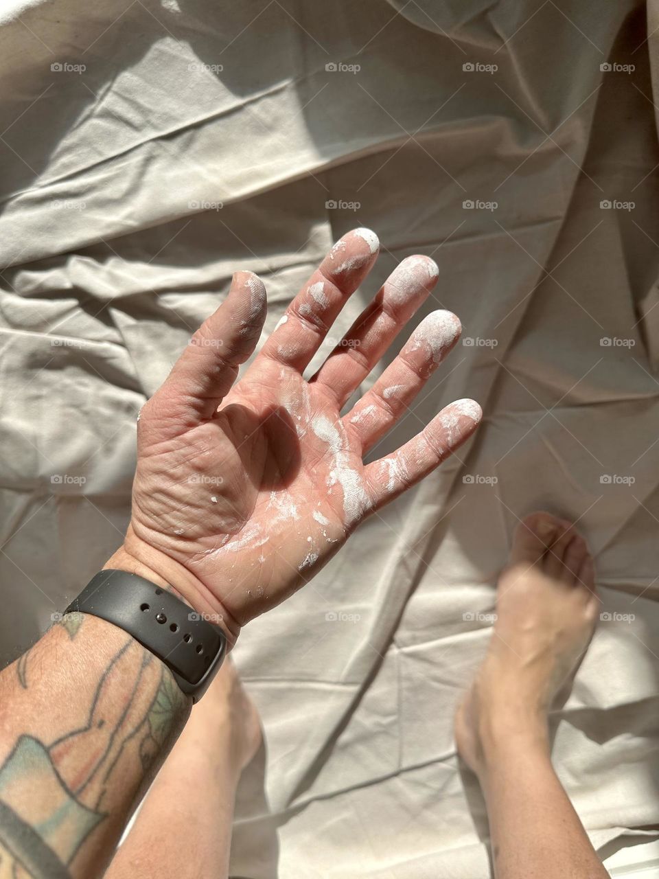 Hand covered in paint, painting at home, home improvement projects, messy painting adventure, paint projects at home, hands getting messy from work, white paint on hand