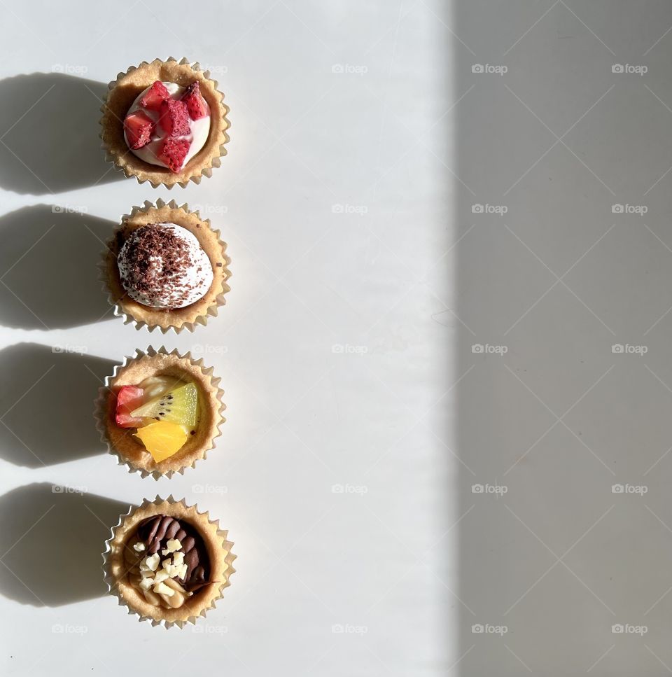 Assorted homebaked Fruit tarts and Nutella chocolate nut butter tarts 