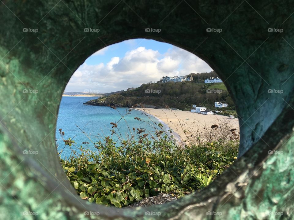 Peeping through for a view. St Ives, Cornwall, England. UK. 