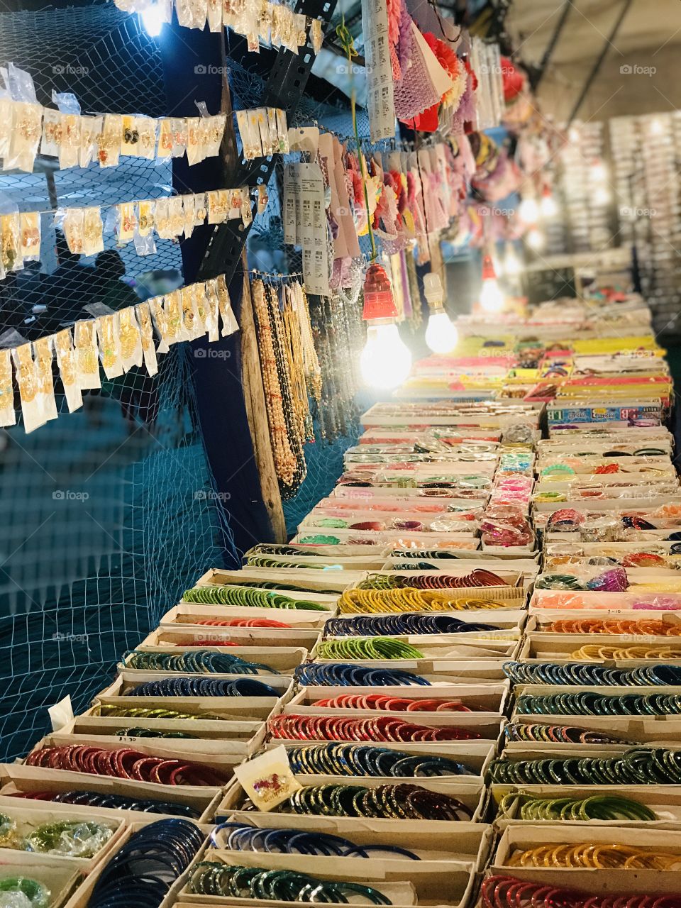 Indian famous mud bangles which are kept in square paper boxes.