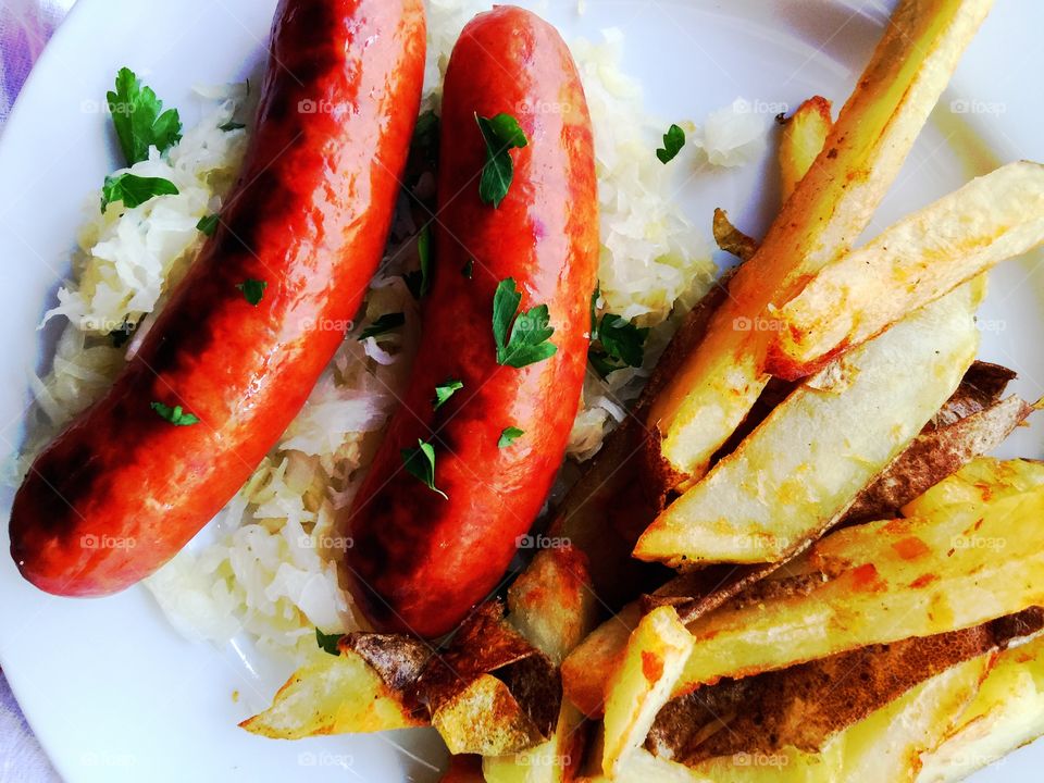 Sausages with fries and sauerkraut