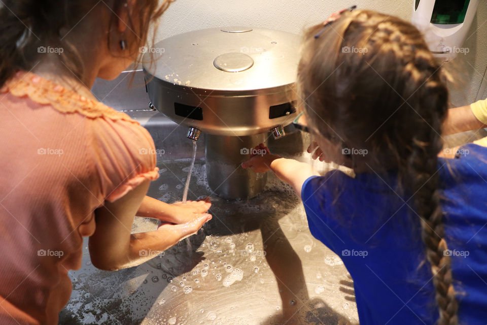 Children washing their hands