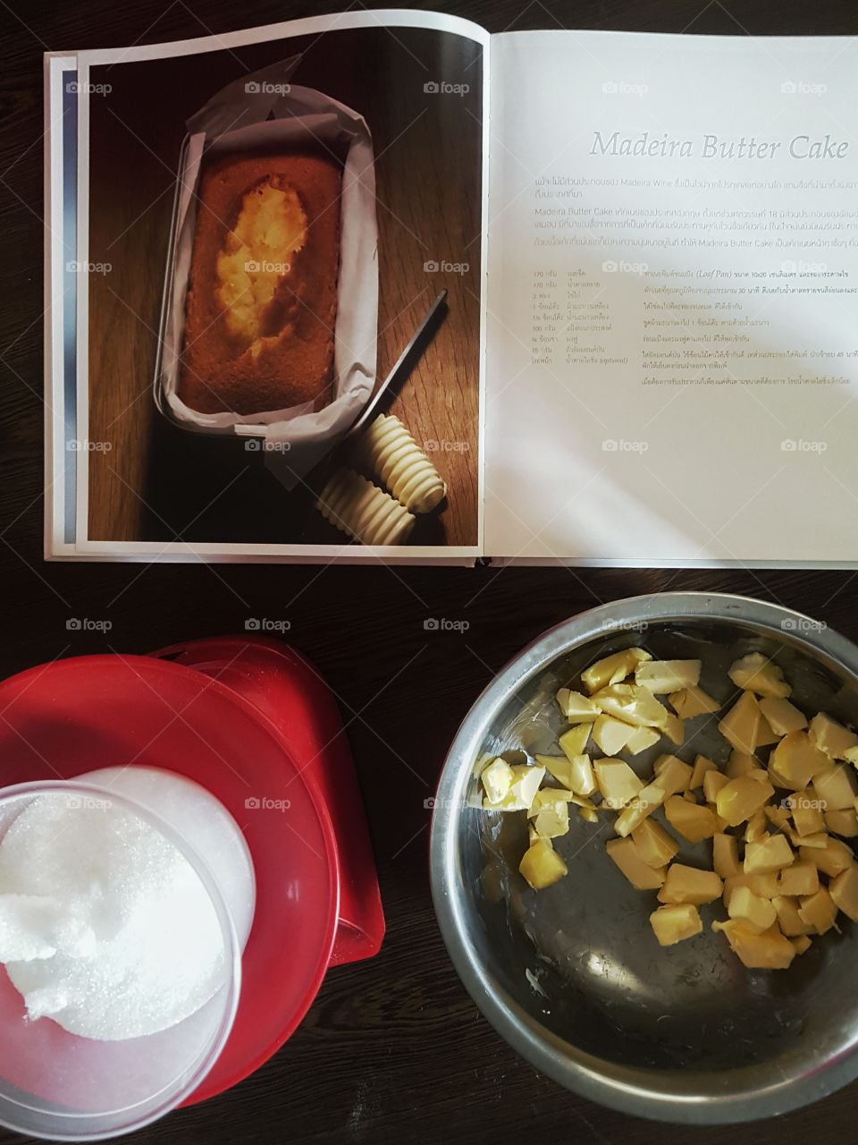 overhead top down view of cake preparation. Food ingredient and book recipe on the table