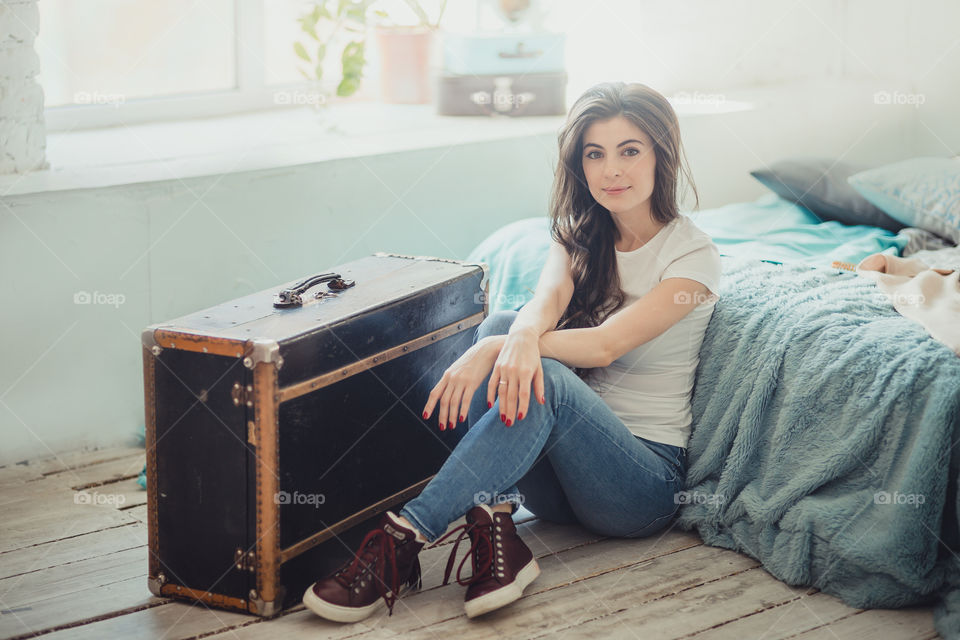 Beautiful young woman at home in daylight 