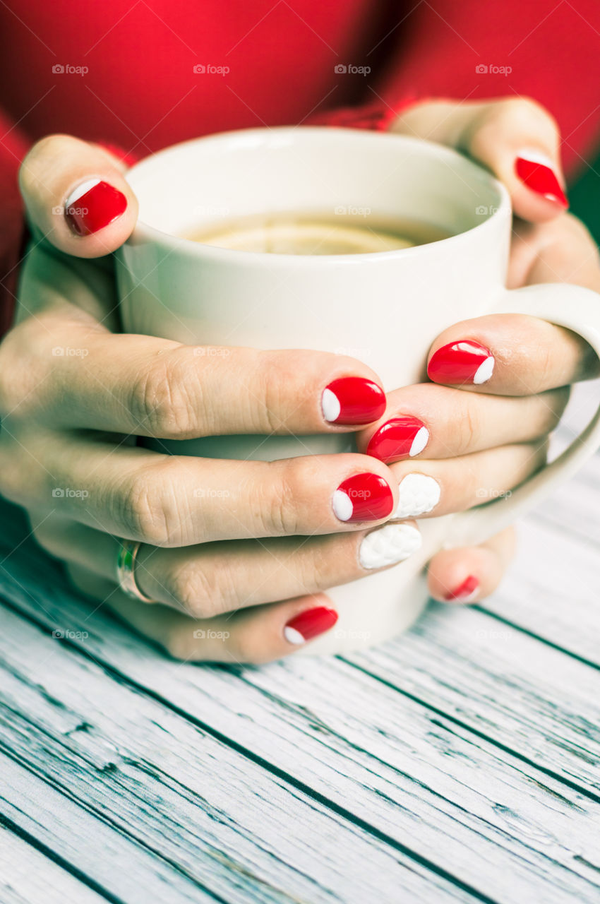 woman hand with cup of tea