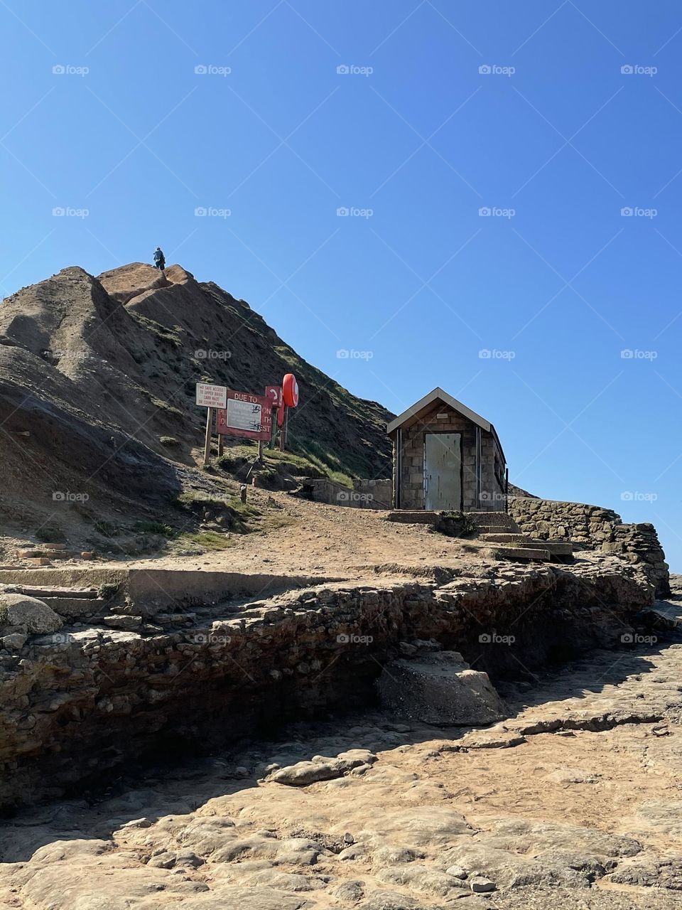 A single hut in a busy world