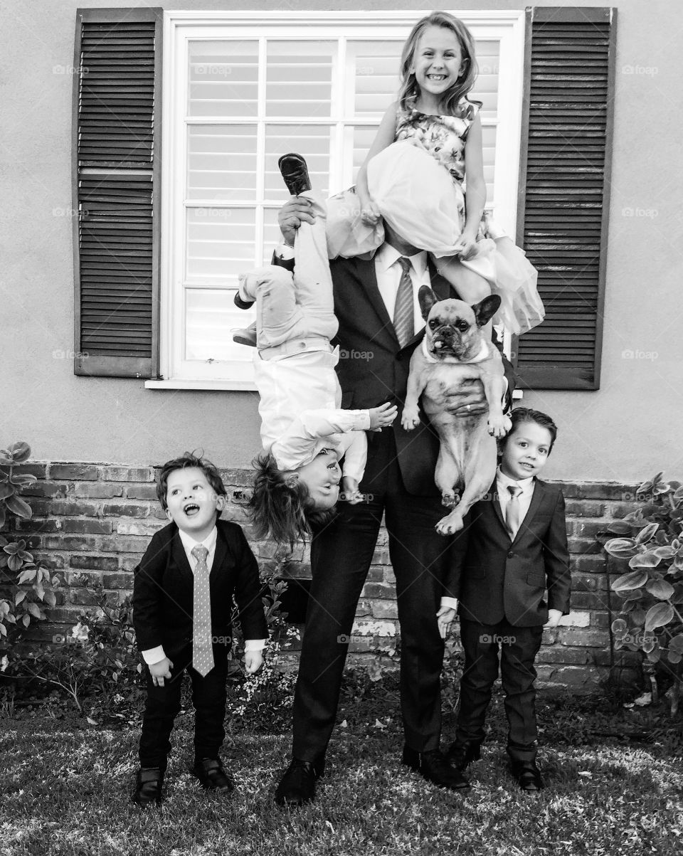 Father and children's with their pet dog