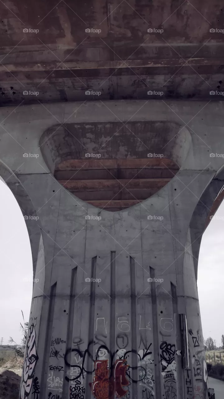 Under the bridge.