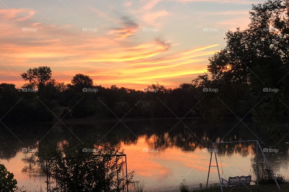 Sunrise Over Holiday Lake, Holiday Lake, Sunrise, sunrise, lake, kayaking, kayak, dock, wood, wooden, floating, water, clouds, reflection, cloudscape, summer, vacation, scenic, grass, trees, light, beautiful, quiet, calm, serene, sky, pond, Missouri 