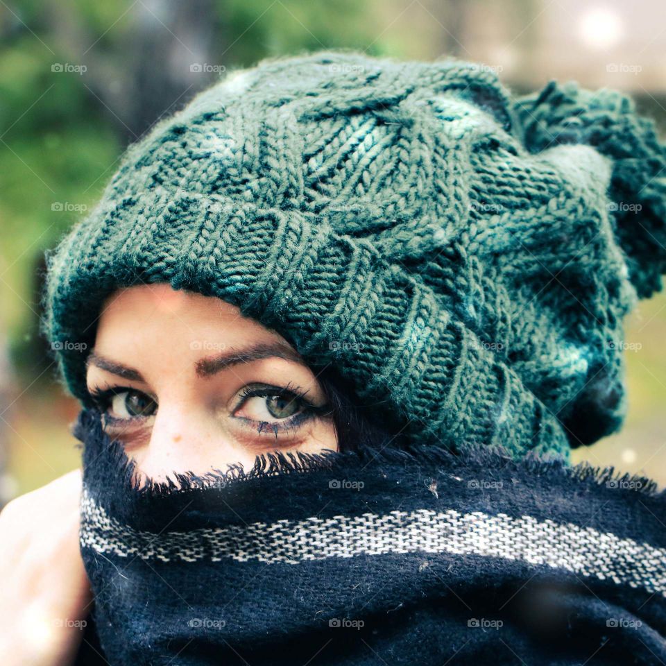 A woman in the snow wearing knit hat