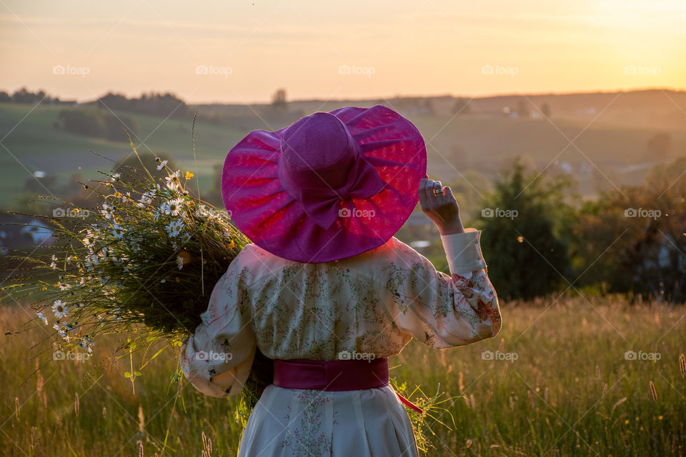 Woman Looking Towards the Setting Sun