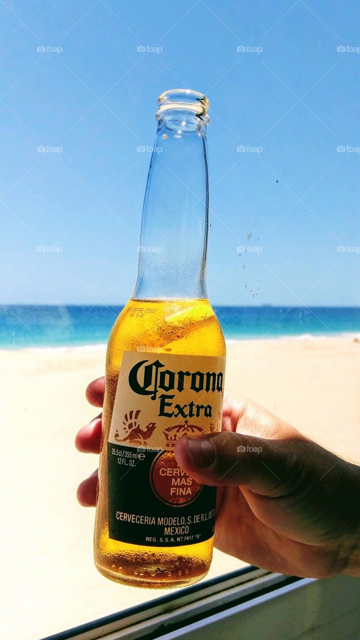 Cheers! Liquid refreshments at the beach.
