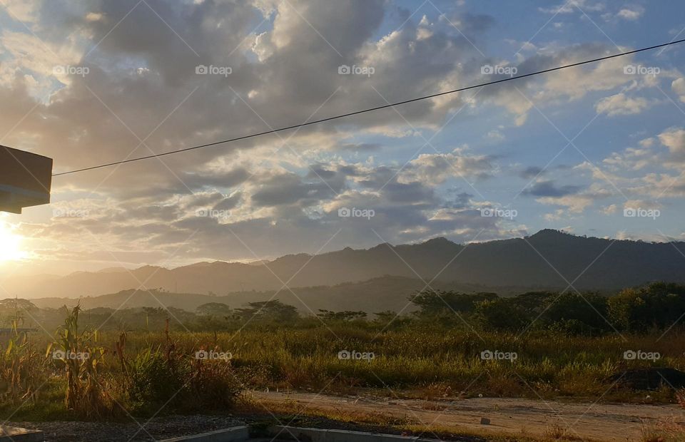 beautiful sunrise on the plain, you can see the mountains and the flash of sunlight on the mountains