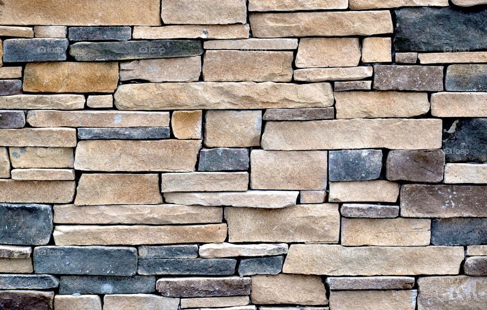 A wall of colorful rectangular bricks