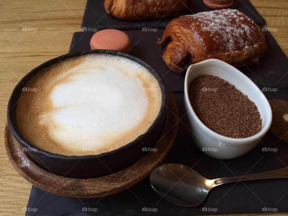 Royal breakfast with cappuccino,brioche and macaron