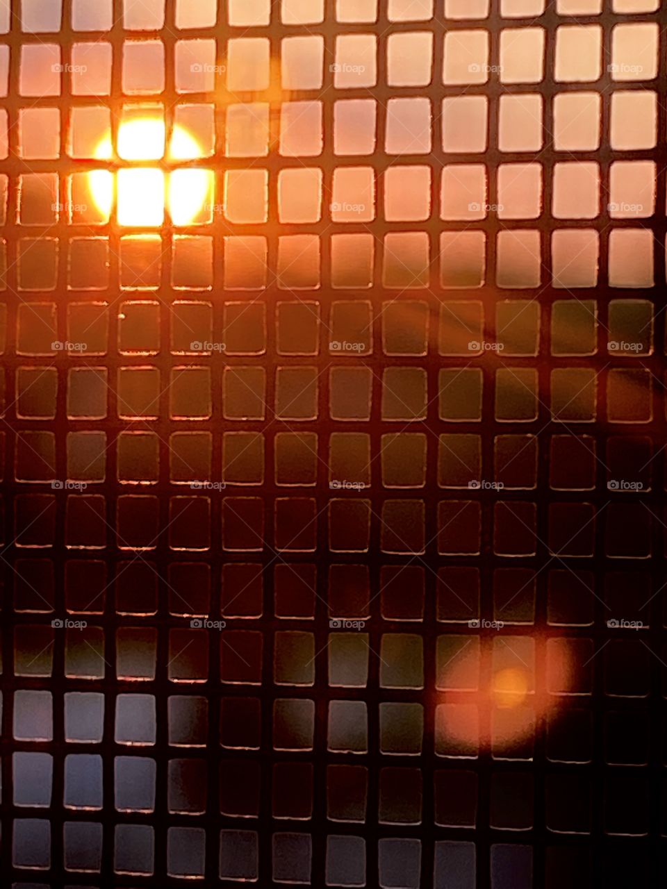 Sunset behind the bars 