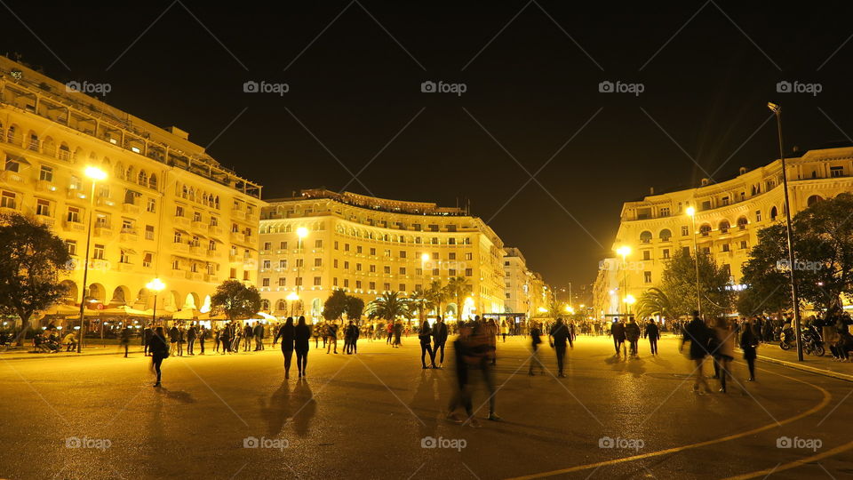 Thessaloniki, Greece at night. Aristotelous main square at night, with people.