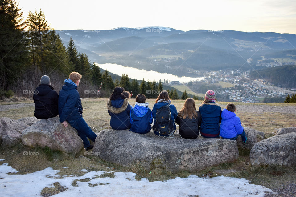 kids and adults enjoy the view in the mountains