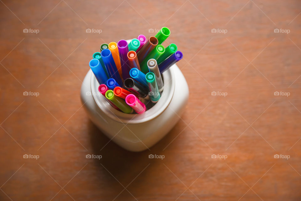 High angle view of colorful maker pens