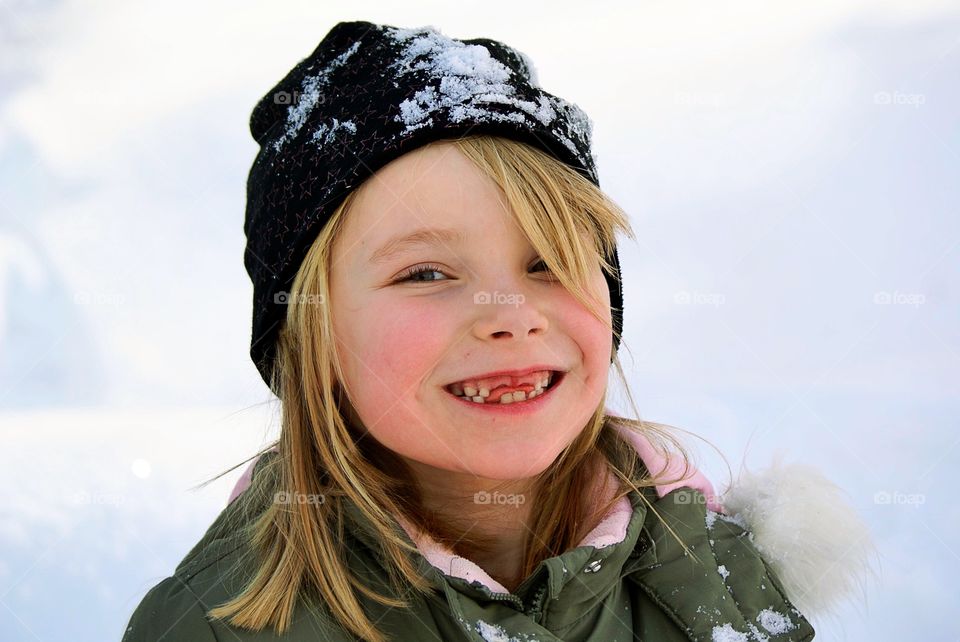 Smiling girl out playing in the snow