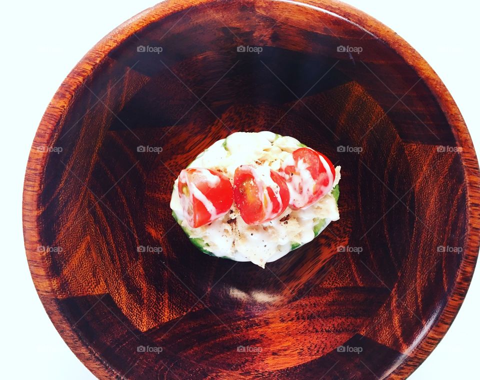 Avocado with tomatoes and tuna