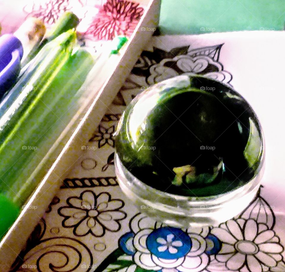 Close-up of Green Art Supplies and Green Round Top