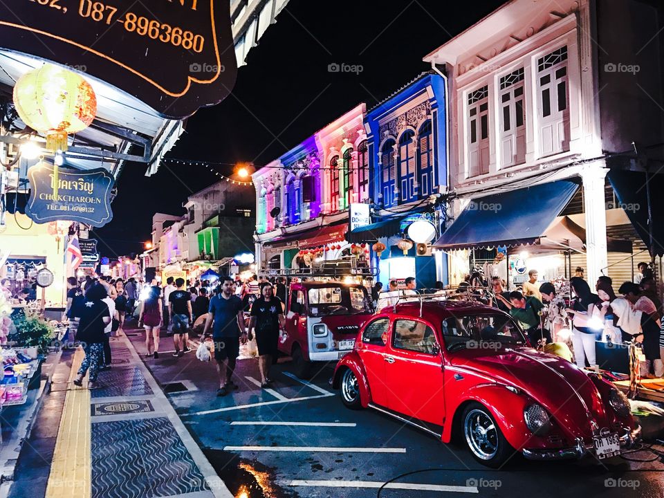 Crowd of tourists enjoy shopping at Lardyai night walking street market in Phuket downtown, popular resort city of southern Thailand