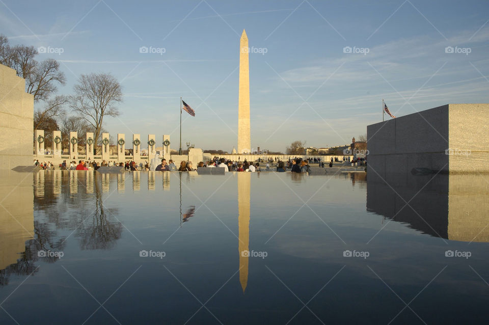 The Washington Monument reflected in a pool at the World War II