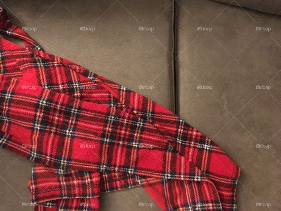 Red plaid fabric on sofa