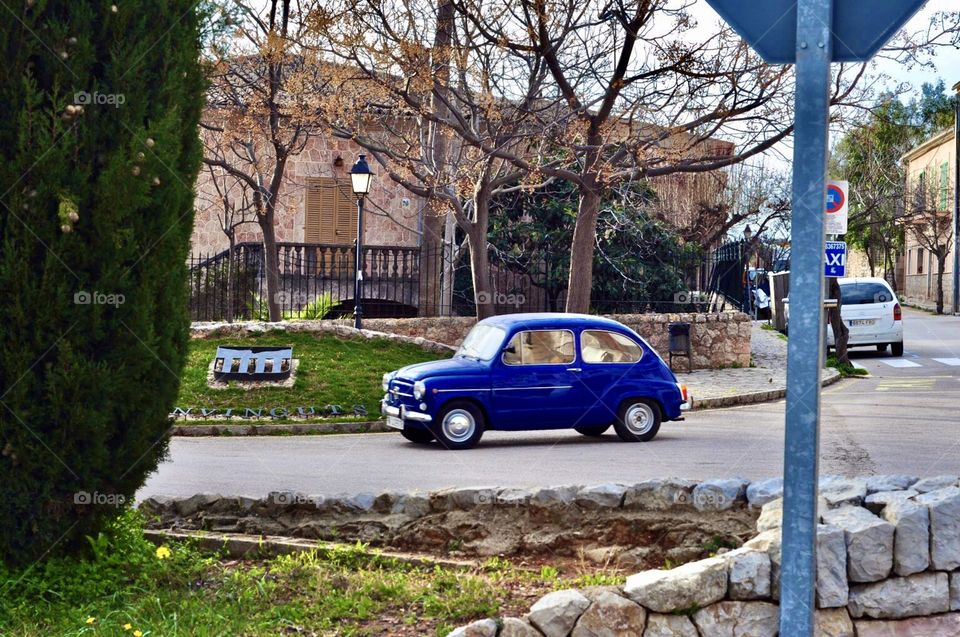 A small blue car