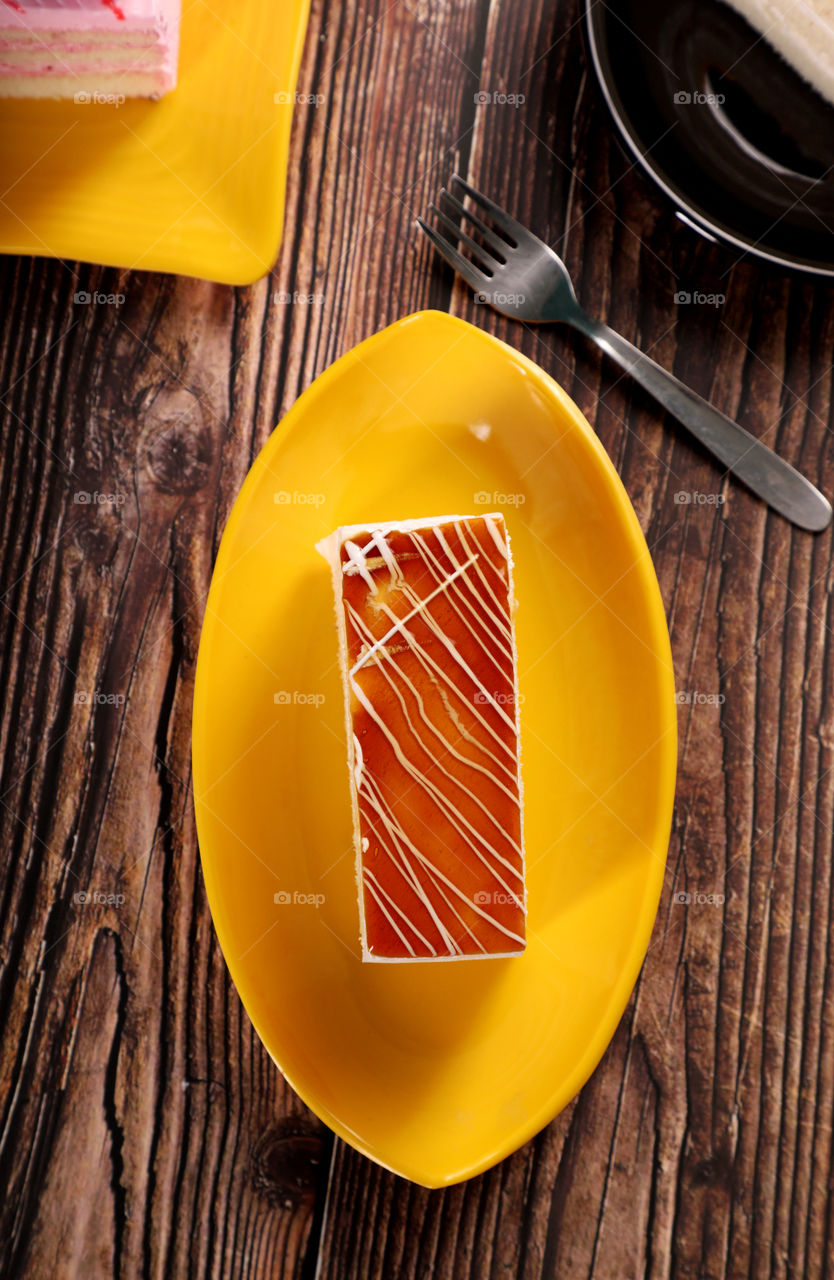 Sweet dessert Pastry cake on old wooden table