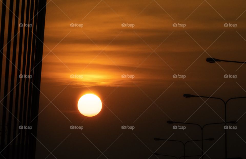 Sun set on the bridge in the big city