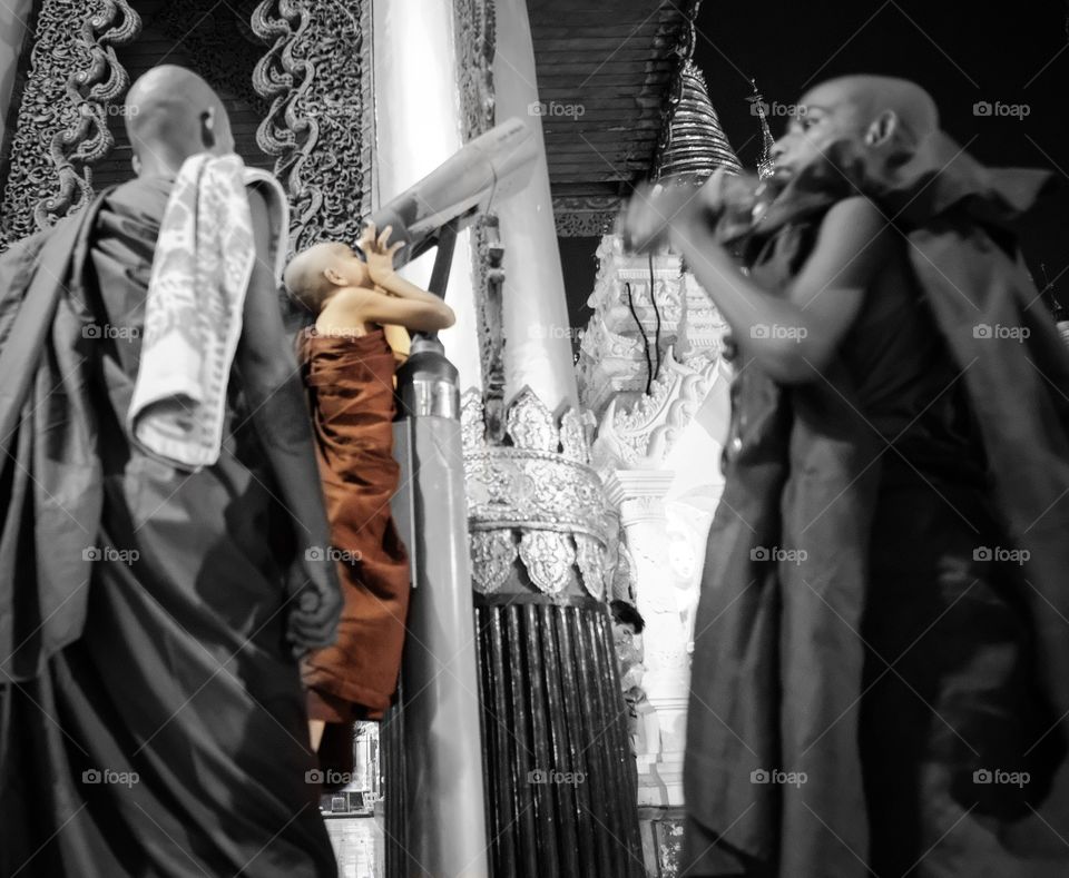 Little monk try to see the top of Shwedagon Pagoda ,Rangoon Myanmar