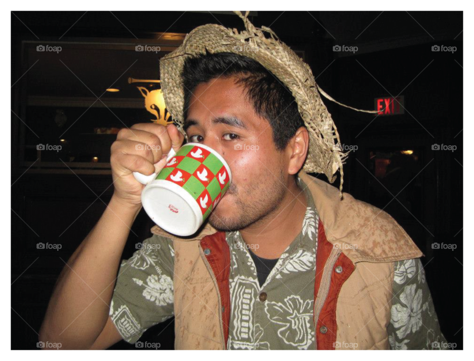 Man drinking from Cup.