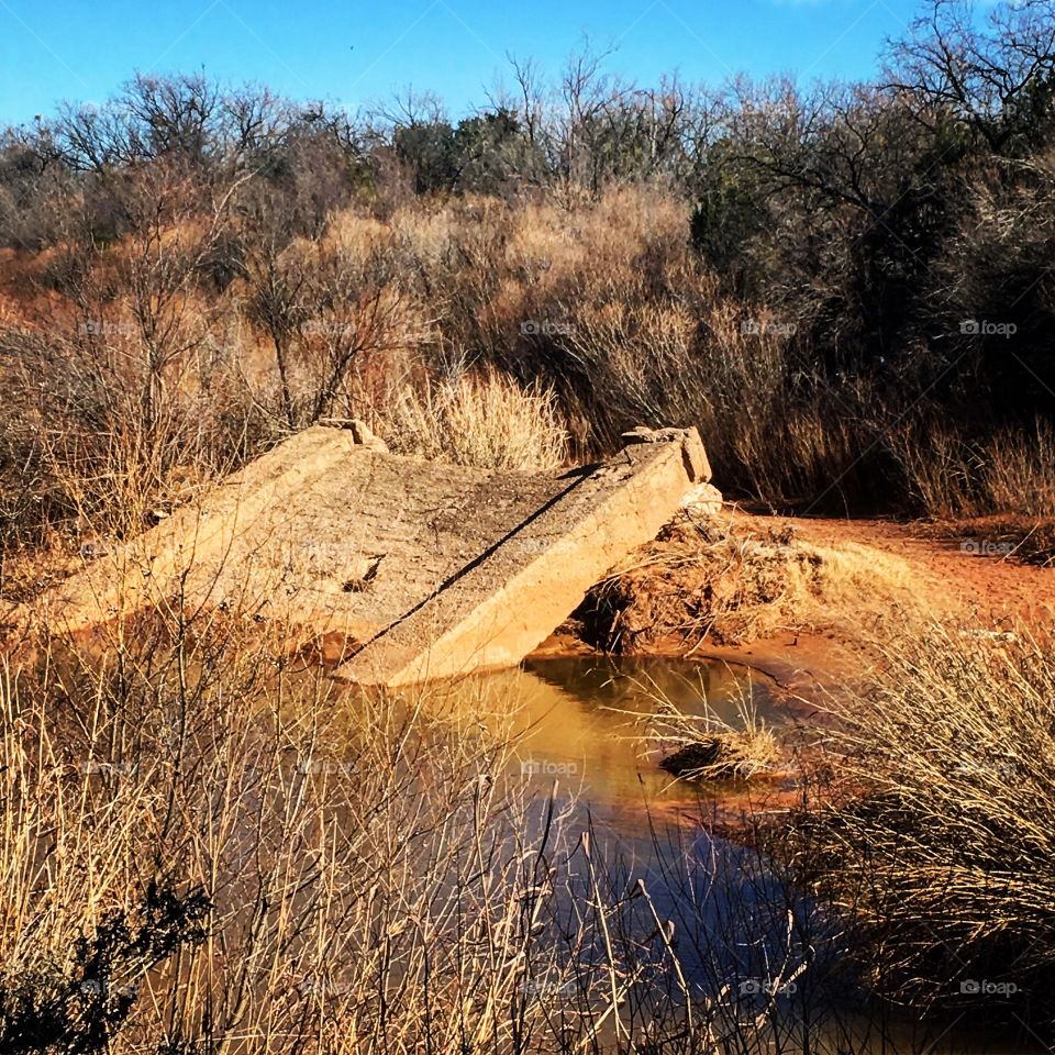 Fallen bridge support on Double Mountain Fork of the Brazos River. 