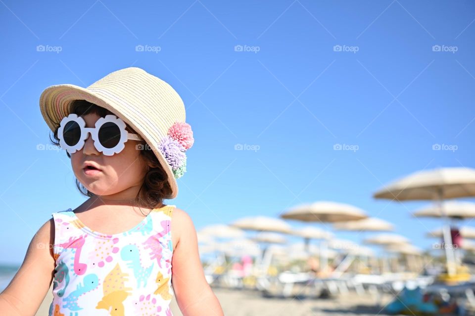 outfit of a little girl at the seaside